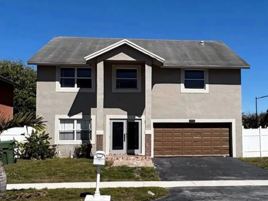 Two-story single-family pool home with a two-car garage on SW 13th Street, Pembroke Pines